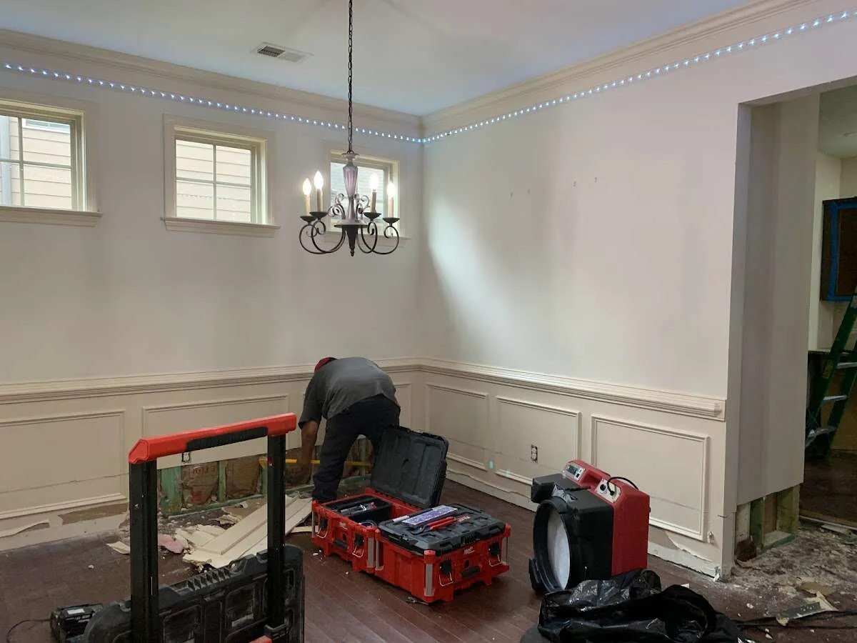 Restoration technician with professional equipment in Clementon